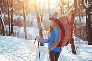 Woman Traveler with backpack hiking Travel Lifestyle adventure concept active vacations outdoor. Beautiful landscape forest