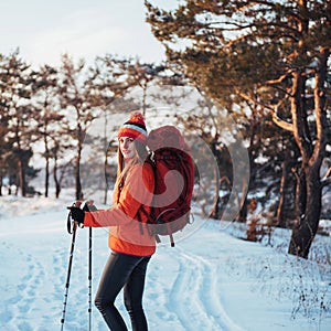 Woman Traveler with backpack hiking Travel Lifestyle adventure concept active vacations outdoor. Beautiful landscape forest