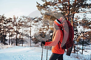 Woman Traveler with backpack hiking Travel Lifestyle adventure concept active vacations outdoor. Beautiful landscape forest