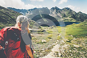 Woman Traveler with backpack hiking photo