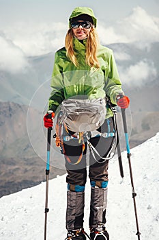 Woman traveler climbing in mountains Travel
