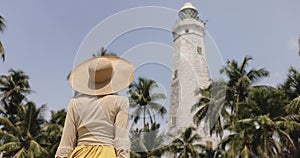 Woman Traveler in Dress and Hat in Front of Famous Landmark of Sri Lanka Country, Dondra Lighthouse
