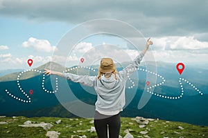 Woman traveler explorer hiking rise hand up on the top of the mountain. Adventure weekend concept.