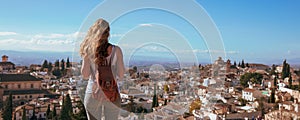 Woman traveler in Granada city panoramic view