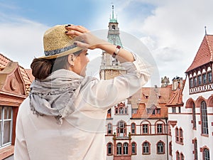 Woman traveler in hat enjoying Hannover City view