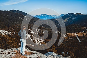 Woman traveler hiking across Croatia landscape.