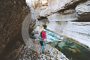 Woman traveler hiking outdoor exploring canyon river