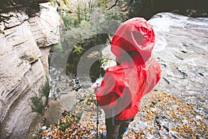 Woman Traveler hiking on rocky cliff