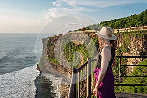 Woman Traveler Looking at View at Uluwatu in Bali, Indonesia