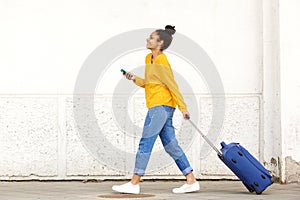 Woman traveler with luggage and mobile phone
