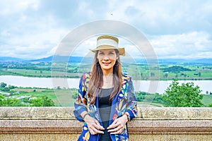 A Woman Traveler with Mekong River Background at Chiang Saen District