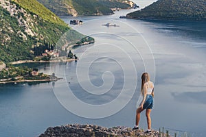 Woman Traveler on Mountain Top above Boka Bay