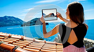 Woman traveler photographing St. Nikola island in