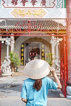 Woman traveler sightseeing at Phouc Kien Assembly hall, translation from Chinese character. The ancient grace of 300 year old