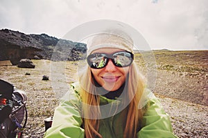 Woman traveler taking selfie in mountains Travel