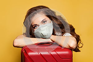 Woman traveler tourist passenger in protective medical mask. Travel, weekends and holidays with Covid-19 pandemic concept photo