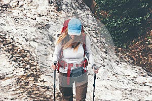 Woman Traveler trail running with backpack