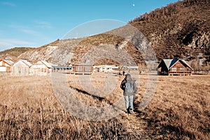 Woman traveler traveling at Napa Lake Grassland, located in Zhongdian city  Shangri-La. landmark and popular spot for tourists