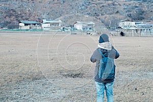 Woman traveler traveling at Napa Lake Grassland, located in Zhongdian city  Shangri-La. landmark and popular spot for tourists