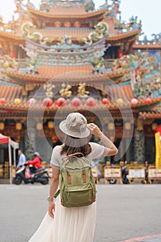 woman traveler visiting in Taiwan, Tourist sightseeing in Songshan Ciyou Temple, near Raohe Night Market, Songshan District,