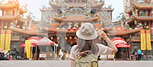 woman traveler visiting in Taiwan, Tourist sightseeing in Songshan Ciyou Temple, near Raohe Night Market, Songshan District,