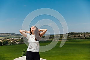 woman traveler walking on top of the mountain