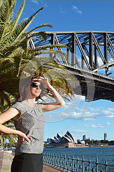 Woman traveler watch the sunset from Sydney Harbor Bridge