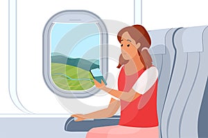 Woman traveling by air plane, sitting on comfortable chair by window with mobile phone