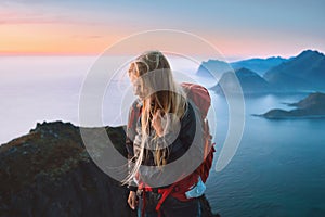 Woman traveling alone in Norway girl traveler hiking in mountains of Lofoten islands outdoor activity healthy lifestyle