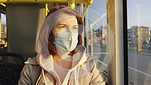 Woman traveling in bus during pandemic