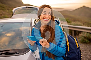 Woman traveling by car on the mountain road