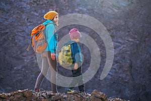 A woman is traveling with a child