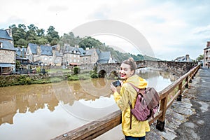 Woman traveling in french town Dinan