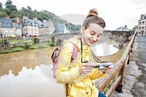 Woman traveling in french town Dinan