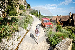 Woman traveling in La Roque Gageac village, France