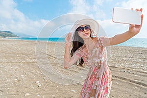 Woman traveling on the overseas holding her mobile