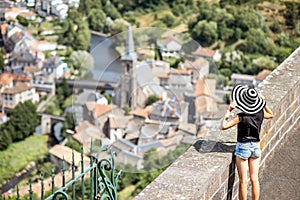 Woman traveling in Saint Flour village in France