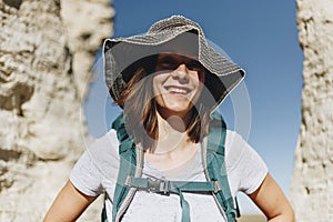 Woman traveling to Oakley with backpack photo