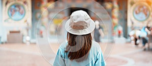 Woman traveling in Wat Mangkorn Kammalawas, Leng Nuei Yee as Chinese temple. Asian traveler visiting at Yaowarat road or Chinatown