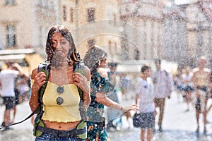 Woman traveller enjoying summer splash