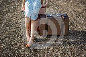 Woman traveller with vintage luggage