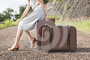 Woman traveller with vintage lugguage in retro color