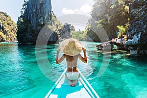 Woman travelling on the boat in Asia