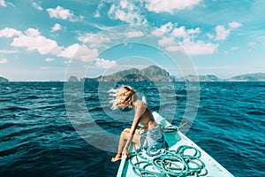 Woman travelling on the boat in Asia