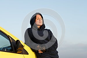 A woman travels by car to places of nature.