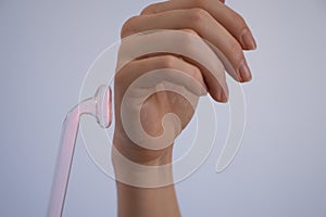 A woman treats her arm with the darsonval device.