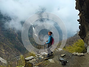 Woman trekker in the mountains