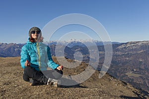 Woman trekker relaxing in mountains