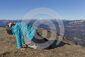 Woman trekker relaxing in mountains