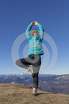 Woman trekker relaxing in mountains